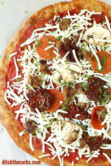 This is THE Fat Head pizza recipe, and it just got better - now with it's own quick cooking video. This is Google's number one low carb and keto pizza. Grain free, gluten free, wheat free heaven. | ditchthecarbs.com
