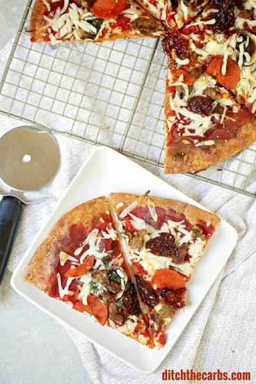 This is THE Fat Head pizza recipe, and it just got better - now with it's own quick cooking video. This is Google's number one low carb and keto pizza. Grain free, gluten free, wheat free heaven. | ditchthecarbs.com