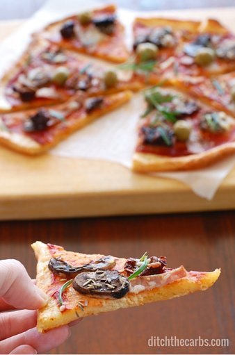You have seriously got to try the best and easiest recipe for low carb pizza out there - Fat Head pizza. It's low carb, wheat free, gluten free and the easiest recipe you'll find. Googles top low carb pizza. #lowcarb #wheatfree #sugarfree #glutenfree | ditchthecarbs.com